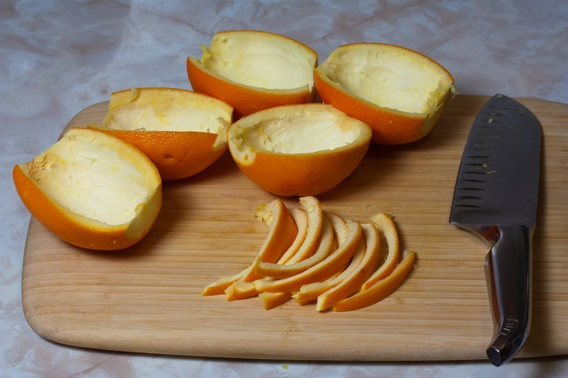 Cut the orange peels with a knife